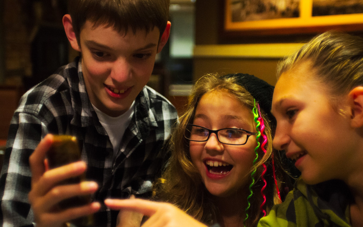 children playing with phone photo kyle mahaney